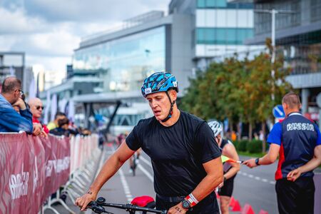 MOSCOW, RUSSIA - AUGUST 25, 2019: Ironman Cycling competition, cyclist athletes riding a race. Ironstar Crocus Fitness Triathlon.のeditorial素材