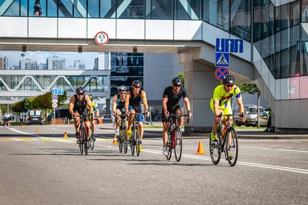 MOSCOW, RUSSIA - AUGUST 25, 2019: Ironman Cycling competition, cyclist athletes riding a race. Ironstar Crocus Fitness Triathlon.のeditorial素材