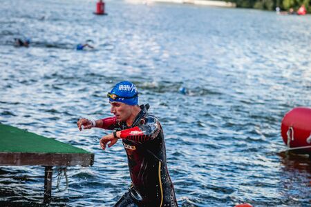 MOSCOW, RUSSIA - AUGUST 25, 2019: Ironman Swimmers on the open waters event Moscow river. Ironstar Crocus Fitness Triathlon 2019.のeditorial素材