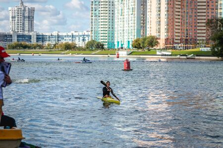 MOSCOW, RUSSIA - AUGUST 25, 2019: Young woman enjoys her kayak workout in the hot weather at Moscow river.のeditorial素材