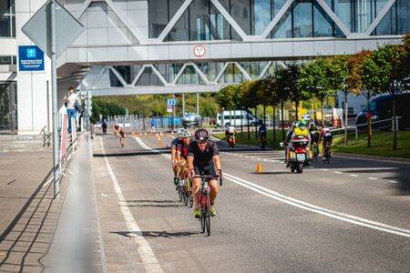 MOSCOW, RUSSIA - AUGUST 25, 2019: Ironman Cycling competition, cyclist athletes riding a race. Ironstar Crocus Fitness Triathlon.のeditorial素材