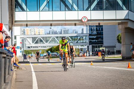 MOSCOW, RUSSIA - AUGUST 25, 2019: Ironman Cycling competition, cyclist athletes riding a race. Ironstar Crocus Fitness Triathlon.のeditorial素材