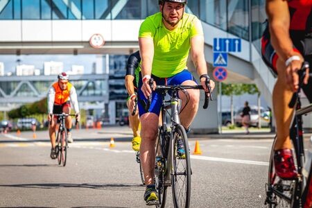 MOSCOW, RUSSIA - AUGUST 25, 2019: Ironman Cycling competition, cyclist athletes riding a race. Ironstar Crocus Fitness Triathlon.のeditorial素材