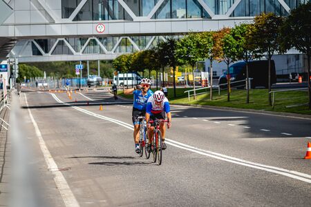 MOSCOW, RUSSIA - AUGUST 25, 2019: Ironman Cycling competition, cyclist athletes riding a race. Ironstar Crocus Fitness Triathlon.のeditorial素材