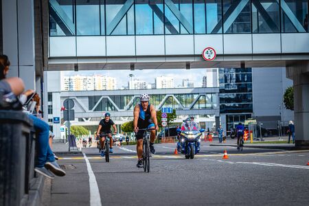 MOSCOW, RUSSIA - AUGUST 25, 2019: Ironman Cycling competition, cyclist athletes riding a race. Ironstar Crocus Fitness Triathlon.のeditorial素材