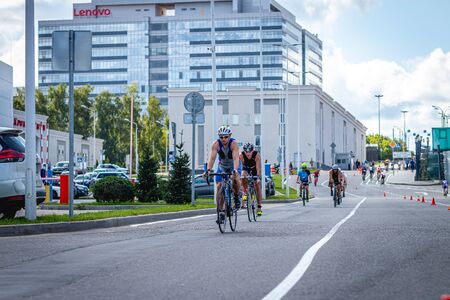 MOSCOW, RUSSIA - AUGUST 25, 2019: Ironman Cycling competition, cyclist athletes riding a race. Ironstar Crocus Fitness Triathlon.のeditorial素材