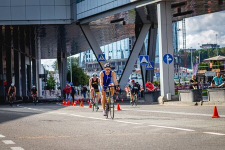 MOSCOW, RUSSIA - AUGUST 25, 2019: Ironman Cycling competition, cyclist athletes riding a race. Ironstar Crocus Fitness Triathlon.のeditorial素材