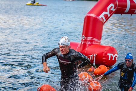MOSCOW, RUSSIA - AUGUST 25, 2019: Ironman Swimmers on the open waters event Moscow river. Ironstar Crocus Fitness Triathlon 2019.のeditorial素材