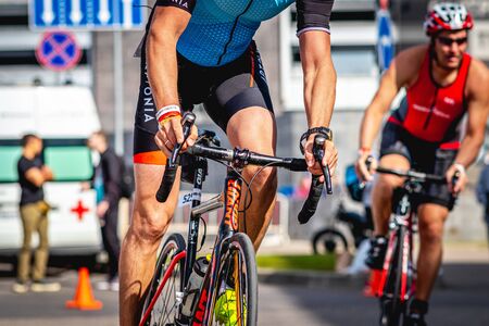 MOSCOW, RUSSIA - AUGUST 25, 2019: Ironman Cycling competition, cyclist athletes riding a race. Ironstar Crocus Fitness Triathlon.のeditorial素材