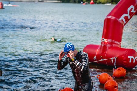 MOSCOW, RUSSIA - AUGUST 25, 2019: Ironman Swimmers on the open waters event Moscow river. Ironstar Crocus Fitness Triathlon 2019.のeditorial素材