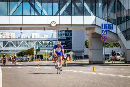 MOSCOW, RUSSIA - AUGUST 25, 2019: Ironman Cycling competition, cyclist athletes riding a race. Ironstar Crocus Fitness Triathlon.のeditorial素材