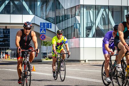 MOSCOW, RUSSIA - AUGUST 25, 2019: Ironman Cycling competition, cyclist athletes riding a race. Ironstar Crocus Fitness Triathlon.のeditorial素材