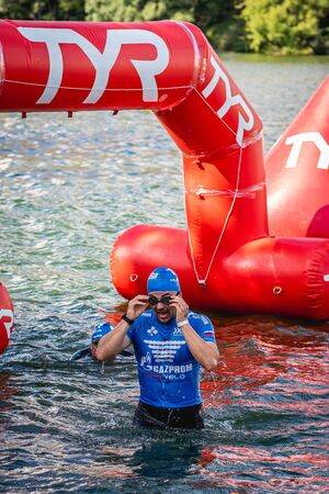 MOSCOW, RUSSIA - AUGUST 25, 2019: Ironman Swimmers on the open waters event Moscow river. Ironstar Crocus Fitness Triathlon 2019.のeditorial素材