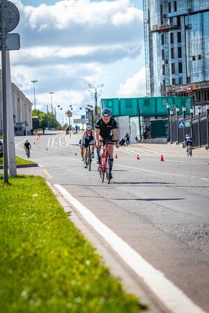 MOSCOW, RUSSIA - AUGUST 25, 2019: Ironman Cycling competition, cyclist athletes riding a race. Ironstar Crocus Fitness Triathlon.のeditorial素材
