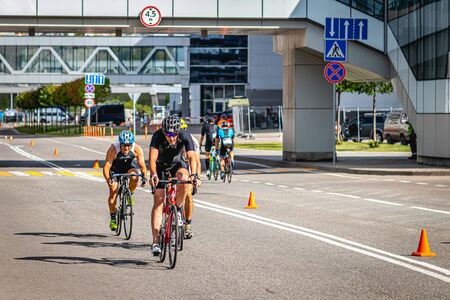 MOSCOW, RUSSIA - AUGUST 25, 2019: Ironman Cycling competition, cyclist athletes riding a race. Ironstar Crocus Fitness Triathlon.のeditorial素材