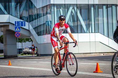 MOSCOW, RUSSIA - AUGUST 25, 2019: Ironman Cycling competition, cyclist athletes riding a race. Ironstar Crocus Fitness Triathlon.のeditorial素材