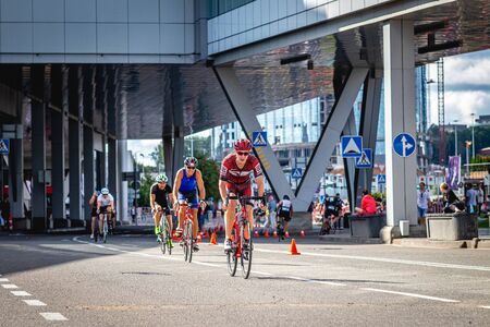 MOSCOW, RUSSIA - AUGUST 25, 2019: Ironman Cycling competition, cyclist athletes riding a race. Ironstar Crocus Fitness Triathlon.のeditorial素材