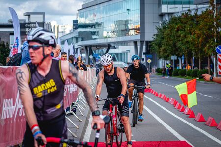 MOSCOW, RUSSIA - AUGUST 25, 2019: Ironman Cycling competition, cyclist athletes riding a race. Ironstar Crocus Fitness Triathlon.のeditorial素材