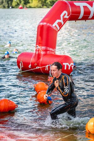 MOSCOW, RUSSIA - AUGUST 25, 2019: Ironman Swimmers on the open waters event Moscow river. Ironstar Crocus Fitness Triathlon 2019.のeditorial素材