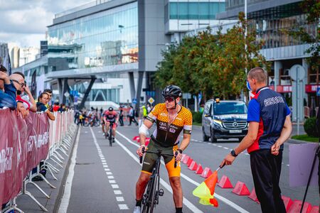 MOSCOW, RUSSIA - AUGUST 25, 2019: Ironman Cycling competition, cyclist athletes riding a race. Ironstar Crocus Fitness Triathlon.のeditorial素材