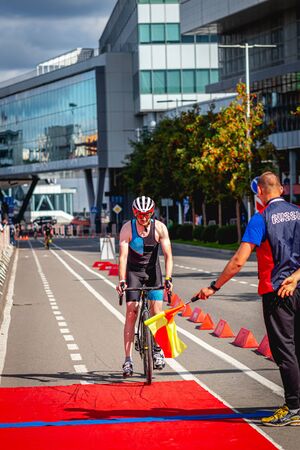 MOSCOW, RUSSIA - AUGUST 25, 2019: Ironman Cycling competition, cyclist athletes riding a race. Ironstar Crocus Fitness Triathlon.のeditorial素材