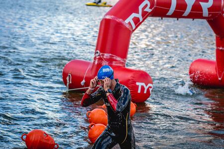 MOSCOW, RUSSIA - AUGUST 25, 2019: Ironman Swimmers on the open waters event Moscow river. Ironstar Crocus Fitness Triathlon 2019.のeditorial素材