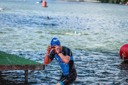 MOSCOW, RUSSIA - AUGUST 25, 2019: Ironman Swimmers on the open waters event Moscow river. Ironstar Crocus Fitness Triathlon 2019.のeditorial素材