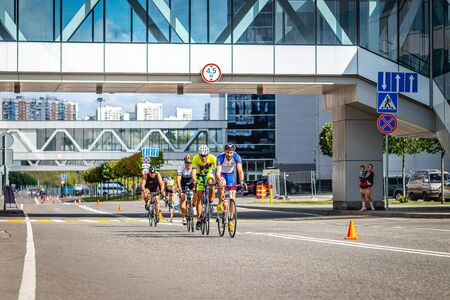 MOSCOW, RUSSIA - AUGUST 25, 2019: Ironman Cycling competition, cyclist athletes riding a race. Ironstar Crocus Fitness Triathlon.のeditorial素材