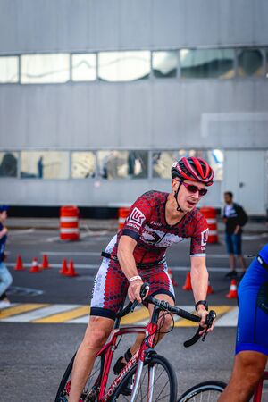 MOSCOW, RUSSIA - AUGUST 25, 2019: Ironman Cycling competition, cyclist athletes riding a race. Ironstar Crocus Fitness Triathlon.のeditorial素材