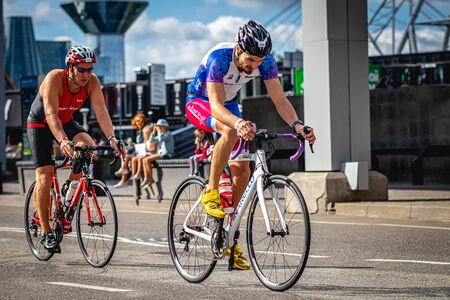 MOSCOW, RUSSIA - AUGUST 25, 2019: Ironman Cycling competition, cyclist athletes riding a race. Ironstar Crocus Fitness Triathlon.のeditorial素材