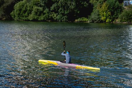MOSCOW, RUSSIA - AUGUST 25, 2019: Kayaker man, kayaks on river, man boating on river.のeditorial素材