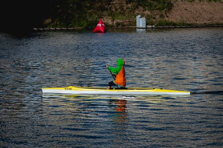 MOSCOW, RUSSIA - AUGUST 25, 2019: Young woman enjoys her kayak workout in the hot weather at Moscow river.のeditorial素材