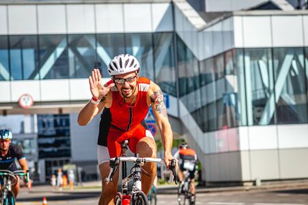 MOSCOW, RUSSIA - AUGUST 25, 2019: Ironman Cycling competition, cyclist athletes riding a race. Ironstar Crocus Fitness Triathlon.のeditorial素材