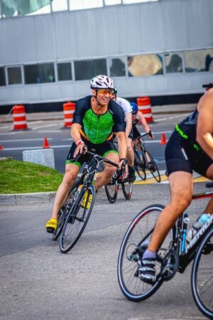 MOSCOW, RUSSIA - AUGUST 25, 2019: Ironman Cycling competition, cyclist athletes riding a race. Ironstar Crocus Fitness Triathlon.のeditorial素材