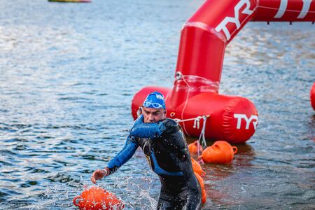 MOSCOW, RUSSIA - AUGUST 25, 2019: Ironman Swimmers on the open waters event Moscow river. Ironstar Crocus Fitness Triathlon 2019.のeditorial素材