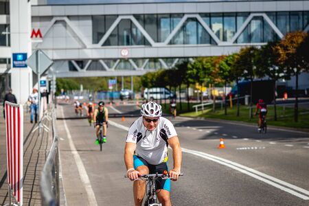 MOSCOW, RUSSIA - AUGUST 25, 2019: Ironman Cycling competition, cyclist athletes riding a race. Ironstar Crocus Fitness Triathlon.のeditorial素材
