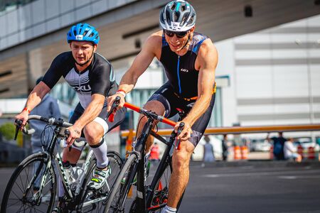 MOSCOW, RUSSIA - AUGUST 25, 2019: Ironman Cycling competition, cyclist athletes riding a race. Ironstar Crocus Fitness Triathlon.のeditorial素材