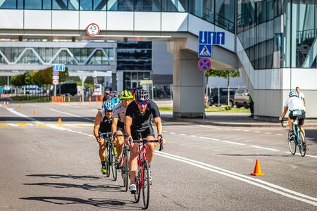 MOSCOW, RUSSIA - AUGUST 25, 2019: Ironman Cycling competition, cyclist athletes riding a race. Ironstar Crocus Fitness Triathlon.のeditorial素材