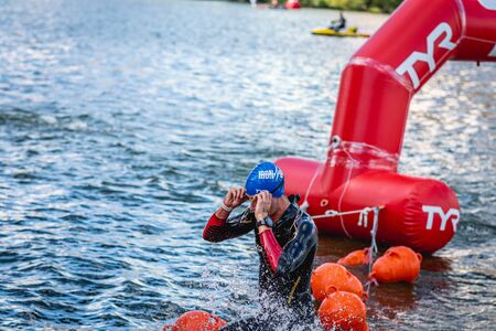 MOSCOW, RUSSIA - AUGUST 25, 2019: Ironman Swimmers on the open waters event Moscow river. Ironstar Crocus Fitness Triathlon 2019.のeditorial素材