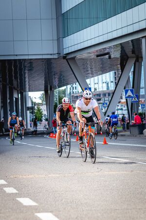 MOSCOW, RUSSIA - AUGUST 25, 2019: Ironman Cycling competition, cyclist athletes riding a race. Ironstar Crocus Fitness Triathlon.のeditorial素材