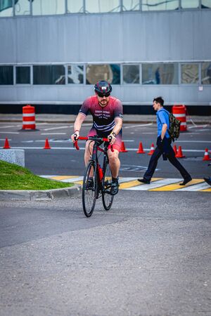 MOSCOW, RUSSIA - AUGUST 25, 2019: Ironman Cycling competition, cyclist athletes riding a race. Ironstar Crocus Fitness Triathlon.のeditorial素材