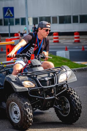 MOSCOW, RUSSIA - AUGUST 25, 2019: Ironman Cycling competition, cyclist athletes riding a race. Ironstar Crocus Fitness Triathlon.のeditorial素材