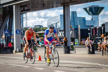MOSCOW, RUSSIA - AUGUST 25, 2019: Ironman Cycling competition, cyclist athletes riding a race. Ironstar Crocus Fitness Triathlon.のeditorial素材