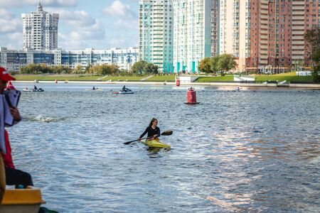 MOSCOW, RUSSIA - AUGUST 25, 2019: Young woman enjoys her kayak workout in the hot weather at Moscow river.のeditorial素材