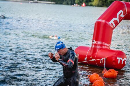 MOSCOW, RUSSIA - AUGUST 25, 2019: Ironman Swimmers on the open waters event Moscow river. Ironstar Crocus Fitness Triathlon 2019.のeditorial素材