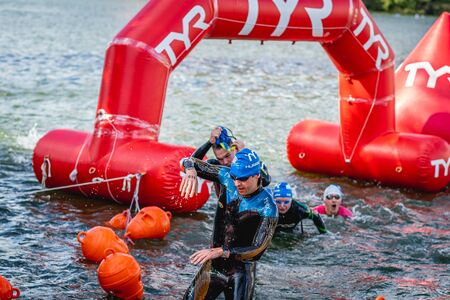 MOSCOW, RUSSIA - AUGUST 25, 2019: Ironman Swimmers on the open waters event Moscow river. Ironstar Crocus Fitness Triathlon 2019.のeditorial素材