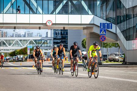 MOSCOW, RUSSIA - AUGUST 25, 2019: Ironman Cycling competition, cyclist athletes riding a race. Ironstar Crocus Fitness Triathlon.のeditorial素材