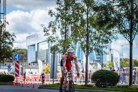 MOSCOW, RUSSIA - AUGUST 25, 2019: Ironman Cycling competition, cyclist athletes riding a race. Ironstar Crocus Fitness Triathlon.のeditorial素材