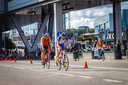 MOSCOW, RUSSIA - AUGUST 25, 2019: Ironman Cycling competition, cyclist athletes riding a race. Ironstar Crocus Fitness Triathlon.のeditorial素材
