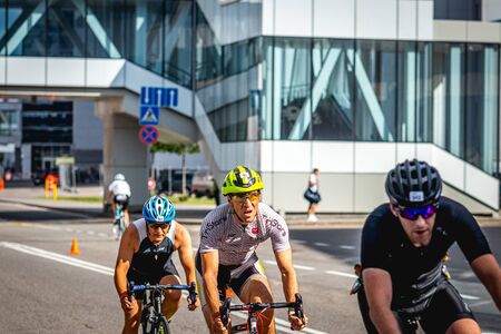 MOSCOW, RUSSIA - AUGUST 25, 2019: Ironman Cycling competition, cyclist athletes riding a race. Ironstar Crocus Fitness Triathlon.のeditorial素材